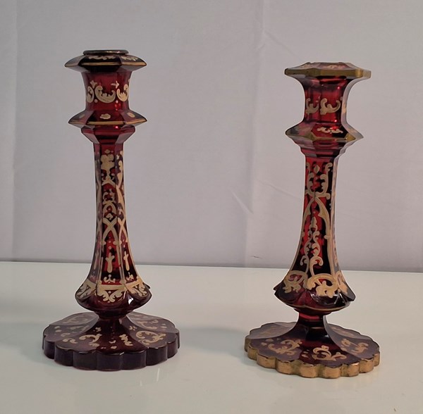 Lot 1194 - RUBY GLASS CANDLESTICKS