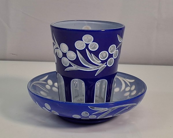 Lot 1348 - BLUE GLASS CUP & SAUCER