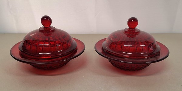 Lot 1309 - A PAIR OF RED GLASS DISHES