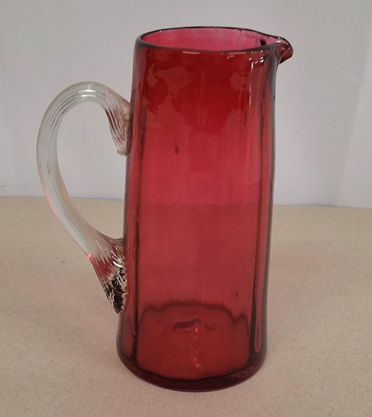 Lot 1218 - CRANBERRY GLASS JUG