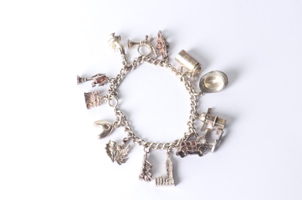 Lot 1048 - SILVER CHARM BRACELET