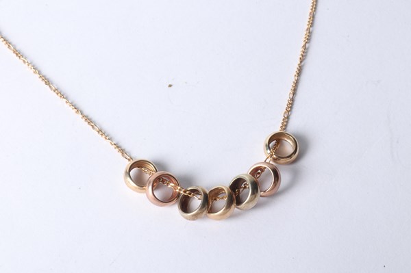 Lot 1018 - SEVEN LUCKY RINGS NECKLACE