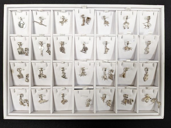 Lot 1104 - SILVER CHARMS