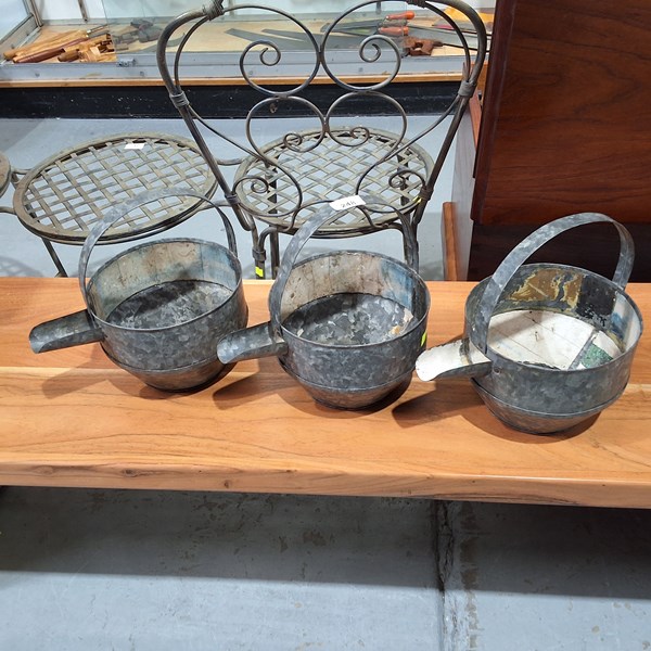 Lot 248 - THREE WATERING CANS