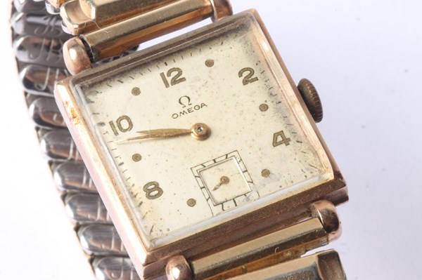 Lot 1057 - GOLD OMEGA WATCH