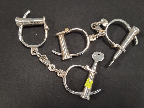 Lot 1234 - TWO PAIRS OF HANDCUFFS