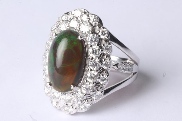 Lot 1020 - GOLD OPAL & DIAMOND RING