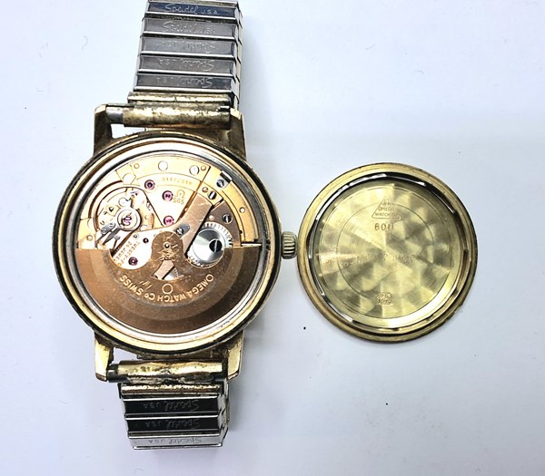 Lot 1034 - GOLD OMEGA WATCH