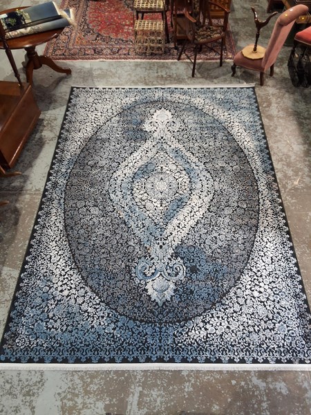 Lot 88 - Contemporary wool rug of large centre...