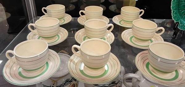 Lot 1264 - NEWPORT POTTERY CUPS & SAUCERS