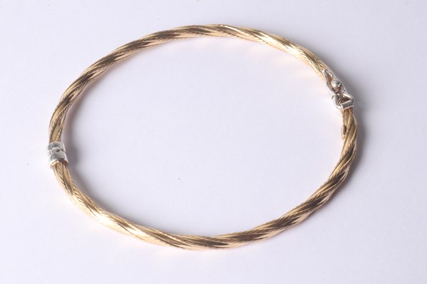 Lot 1012 - GOLD PLATED BANGLE