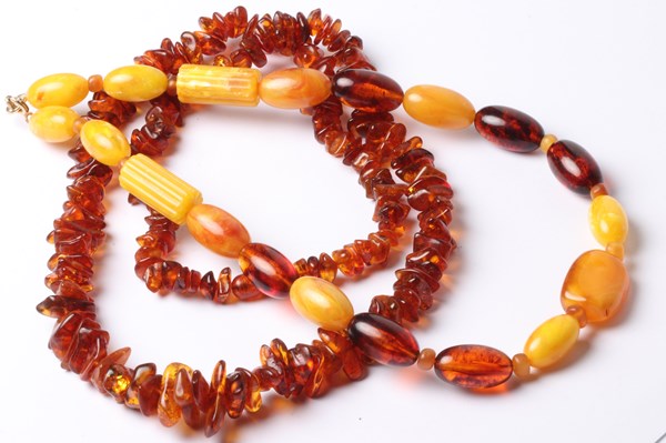 Lot 1080 - TWO AMBER BEAD NECKLACES