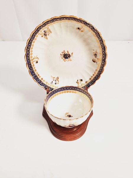 Lot 1213 - CAUGHLEY TEA BOWL AND SAUCER