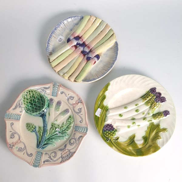 Lot 1290 - THREE MAJOLICA ASPARAGUS PLATES