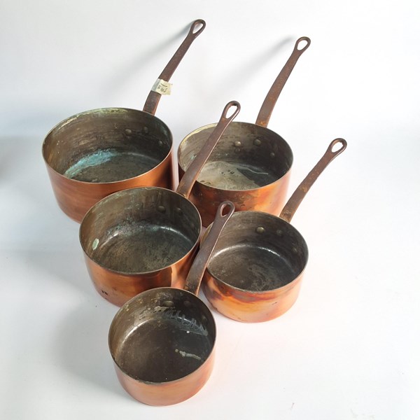 Lot 1263 - GRADUATED COPPER SAUCEPANS