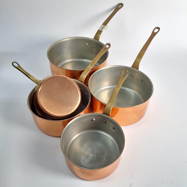 Lot 1232 - GRADUATED COPPER SAUCEPANS