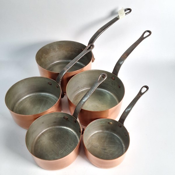 Lot 1253 - GRADUATED COPPER SAUCEPANS