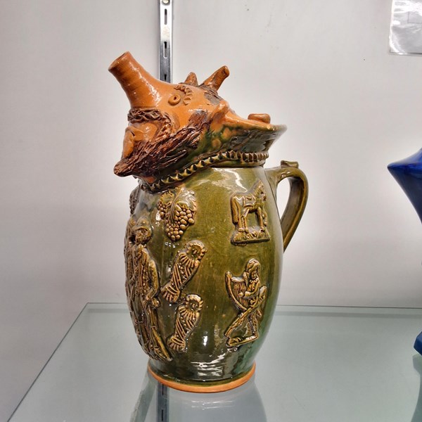 Lot 1457 - FIGURATIVE TERRACOTTA JUG