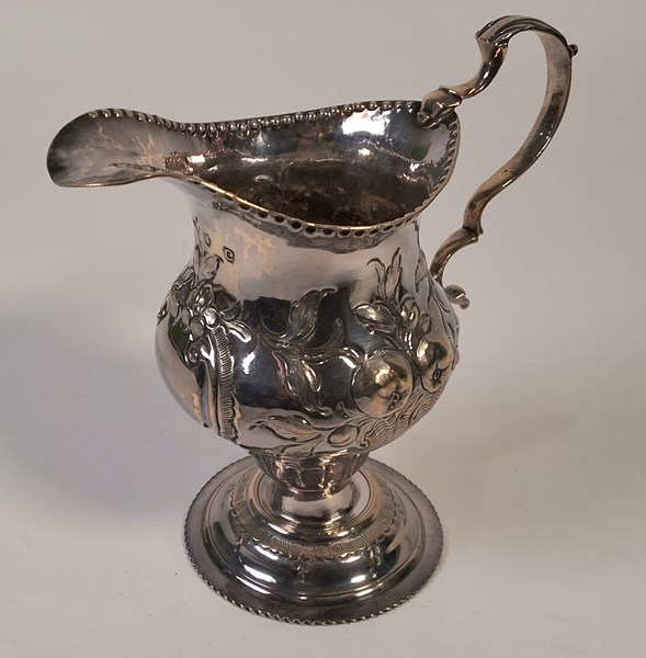 Lot 1012 - SILVER JUG