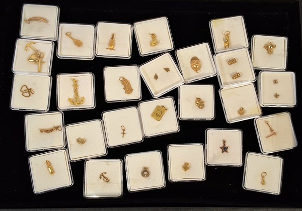 Lot 1136 - GOLD CHARMS