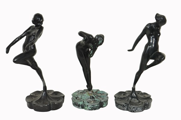 Lot 128 - SET OF FIGURAL FLOWER FROGS